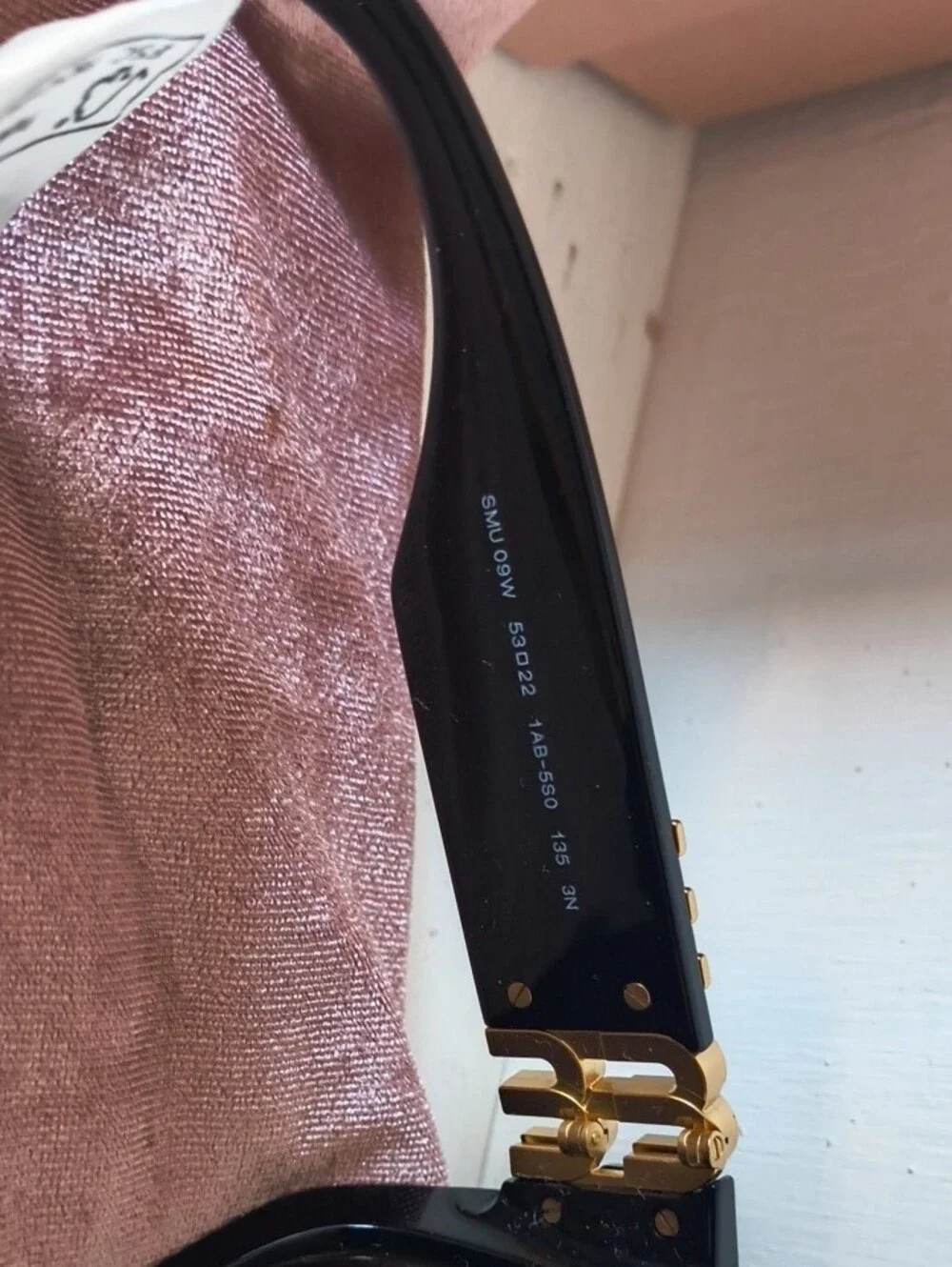Miu Miu Black Sunglasses with Gold Logo Accent